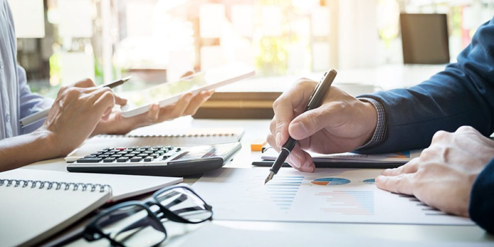 business man financial inspector and secretary making report, calculating or checking balance. Internal Revenue Service inspector checking document. Audit concept
